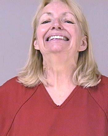 Woman Proudly References Her Crime in Mug Shot Facial Expression