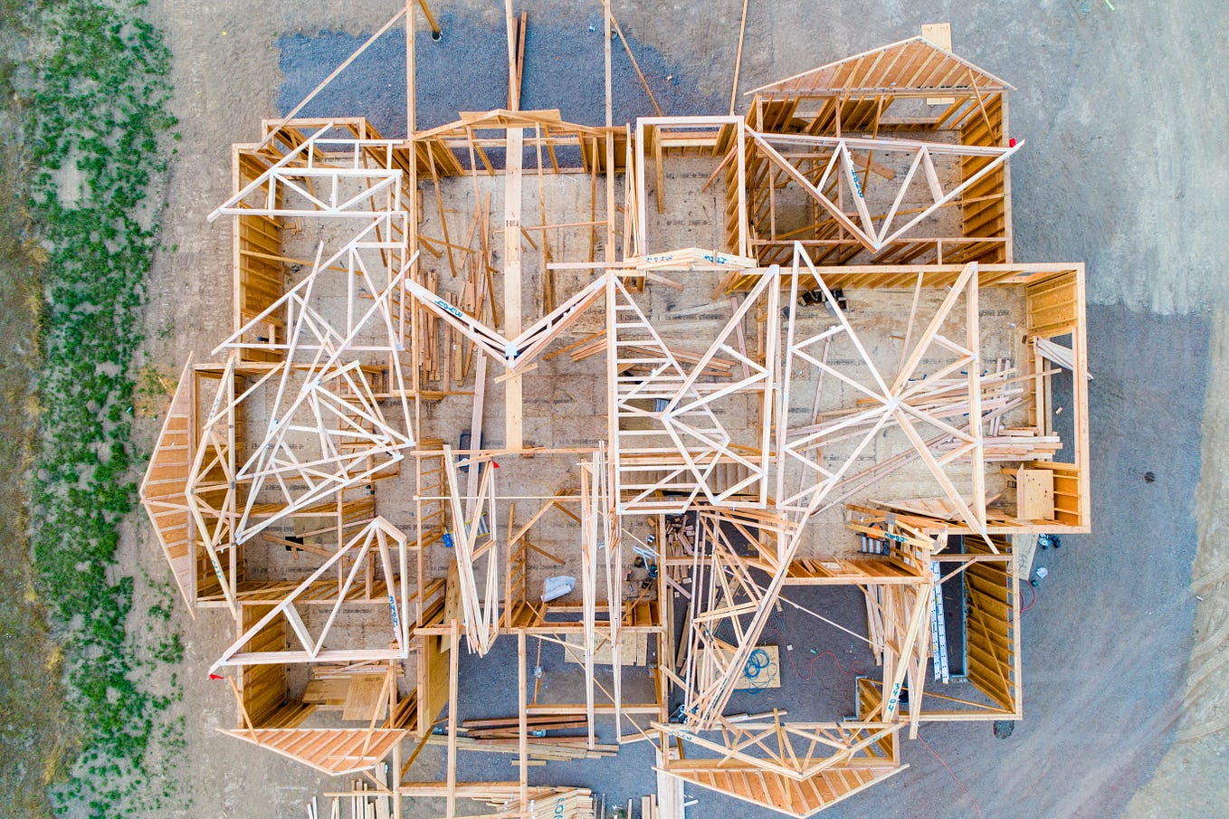 An arial view of a wooden house frame under construction