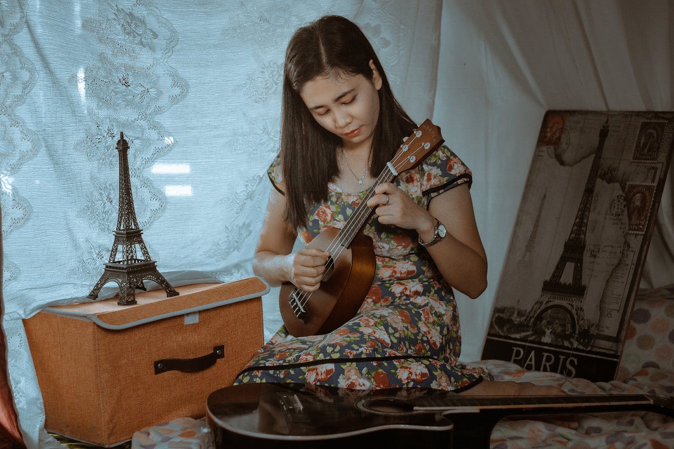 Girl playing the ukulele.