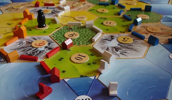 Settlers of Catan game board showing resources with numbers associated with each tile