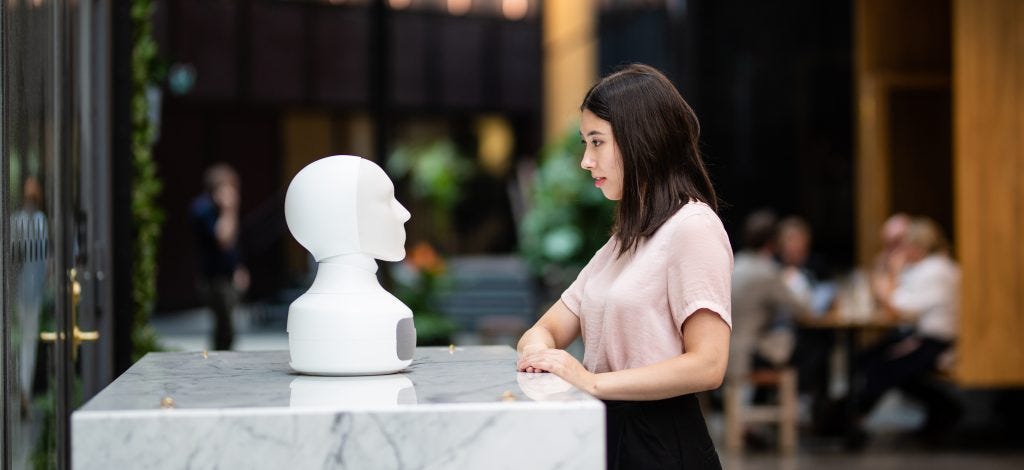 Girl with social robot Furhat