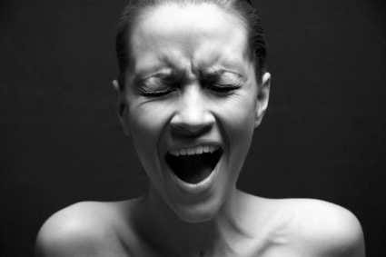 black and white closeup, woman screaming, eyes closed