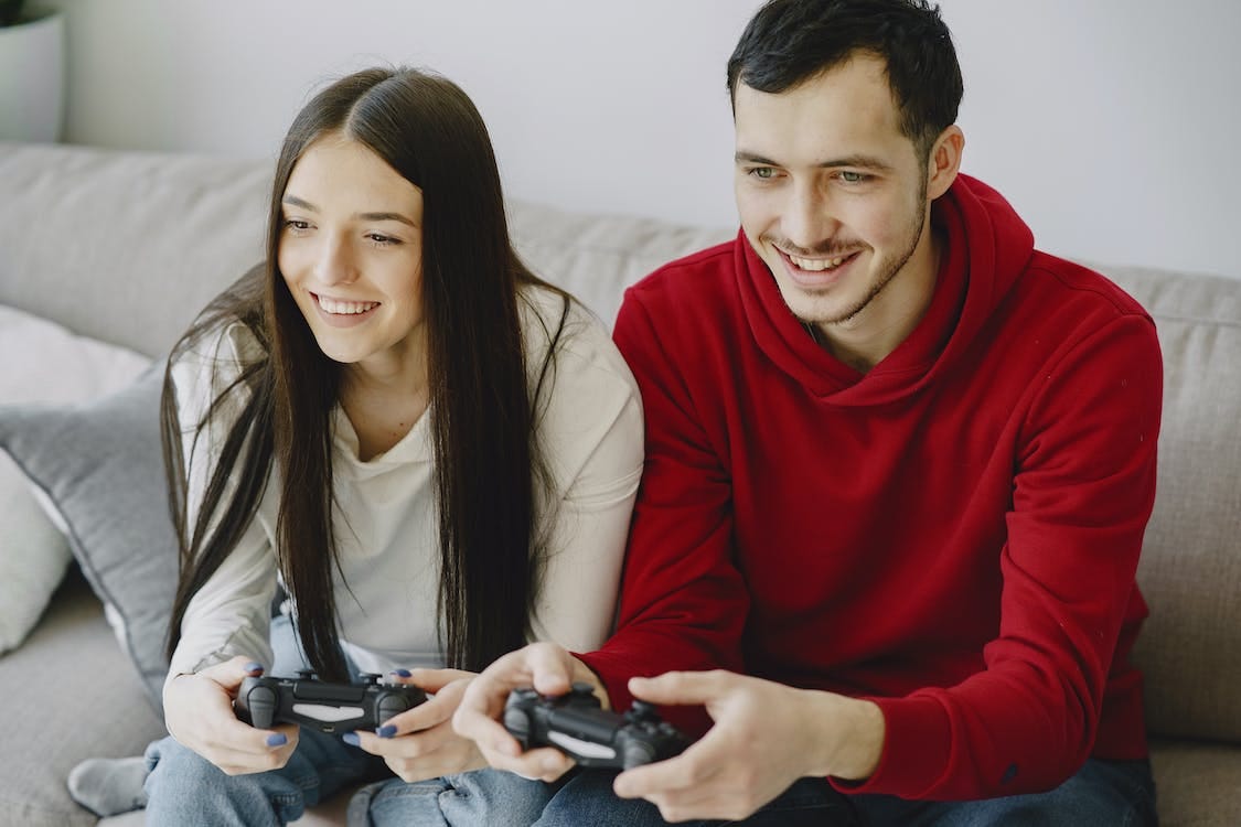 Thoughtful Boyfriend while Playing Online Games with Hig Beautiful  Girlfriend Stock Image - Image of expression, couple: 165904571