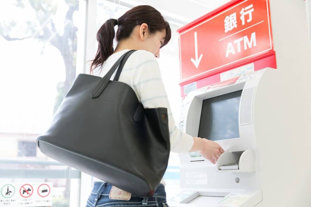 Woman withdrawing money from ATM