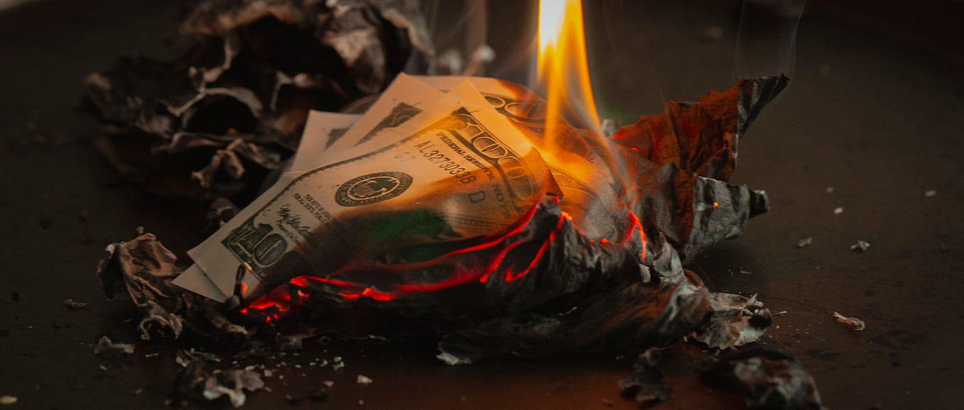 Dollar notes burning