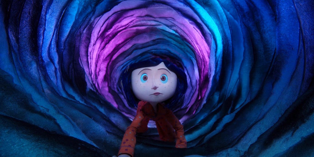 Coraline crawling through the tunnel into the Other World