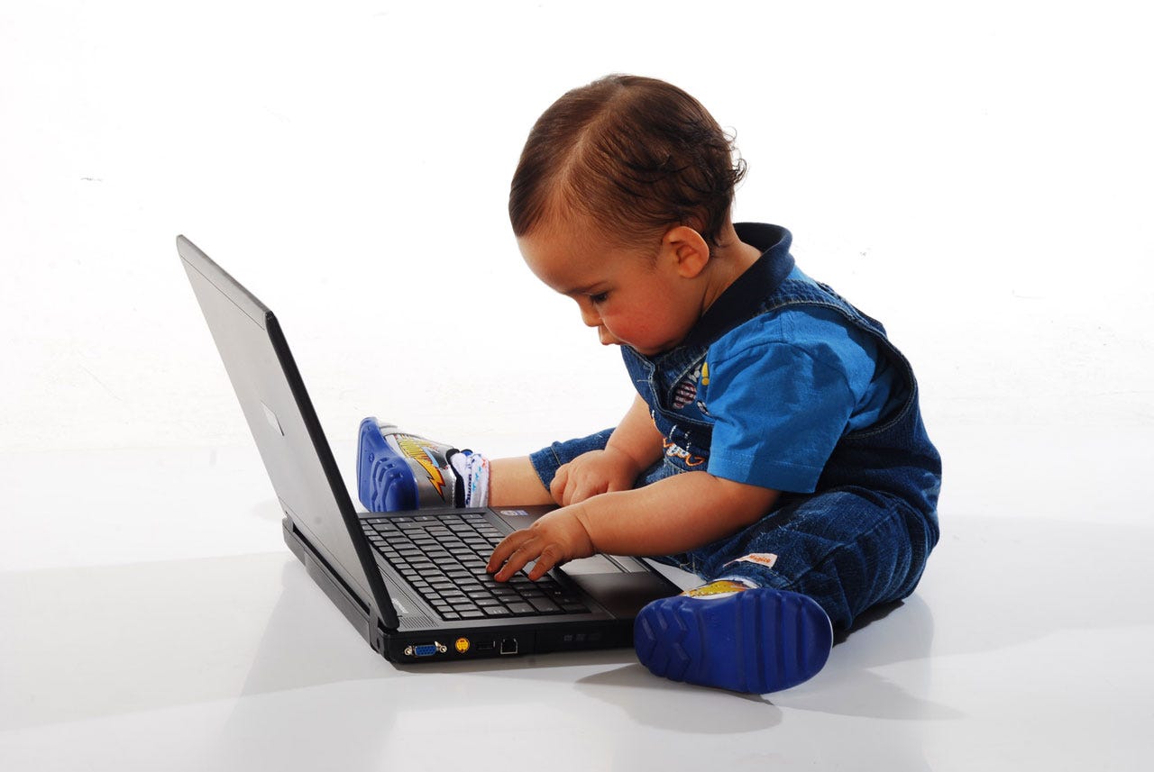 A baby on a computer