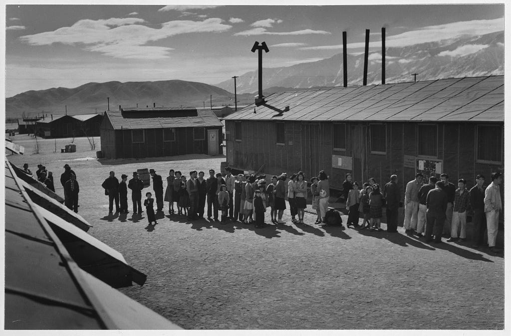 Ansel Adams photograph of the mess hall lunch line at the Manzanar Relocation Center, California.
