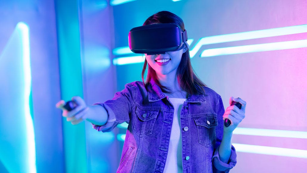 A woman playing with a VR headset