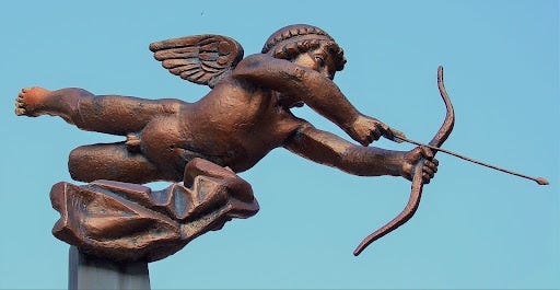 a bronze statue of cupid