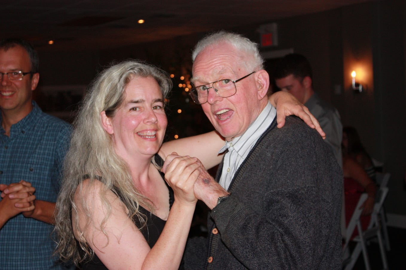 photo of author and her father dancing together at nephew’s wedding — both with happy smiles