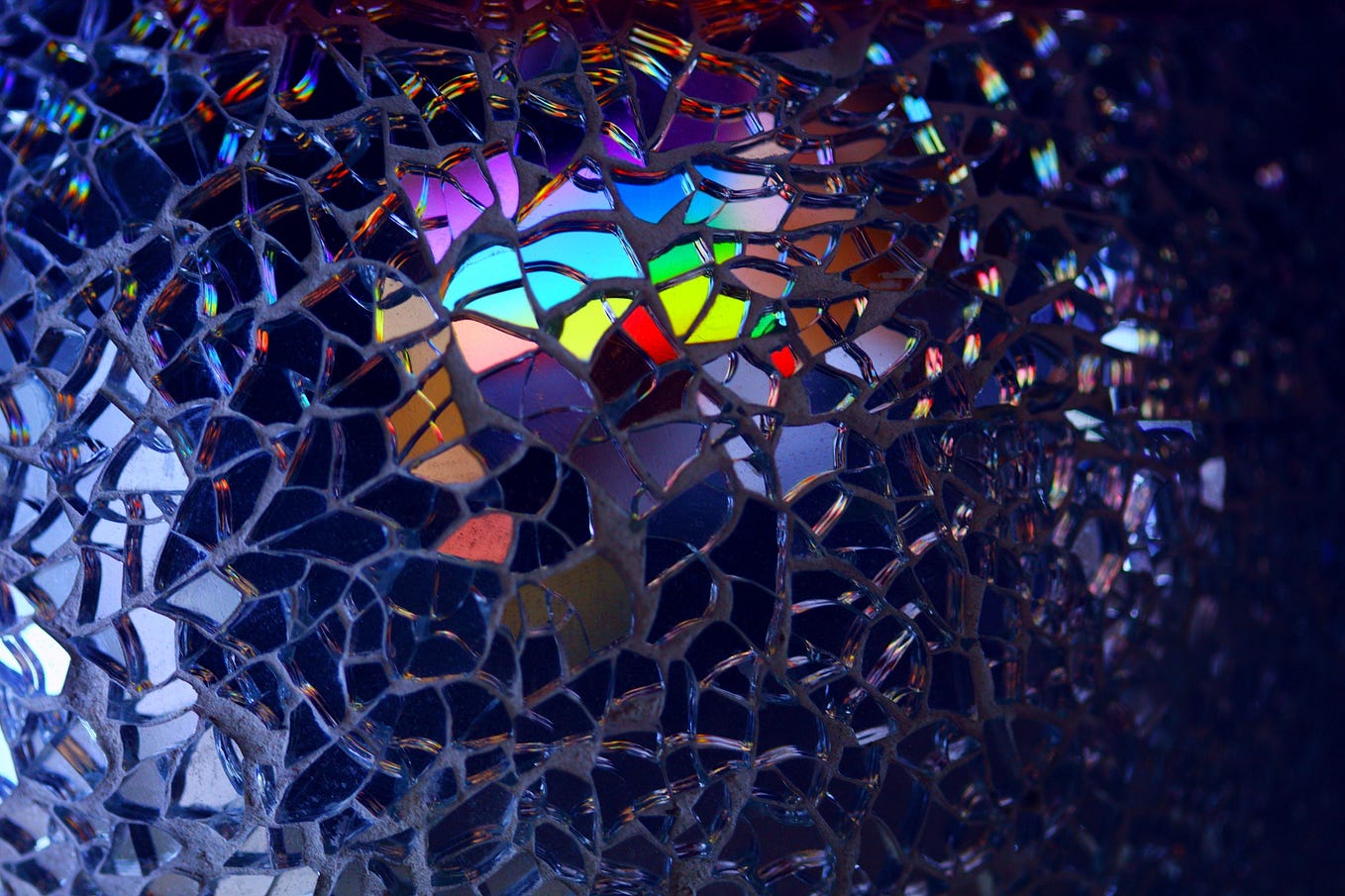 Photo of a fragmented mirror with different colors showing is CC0 courtesy of pexels.com