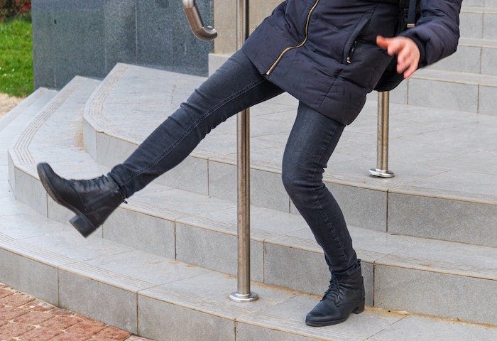 Woman falling down stairs