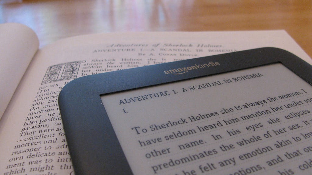 How does traditional book reading differ from digital reading?