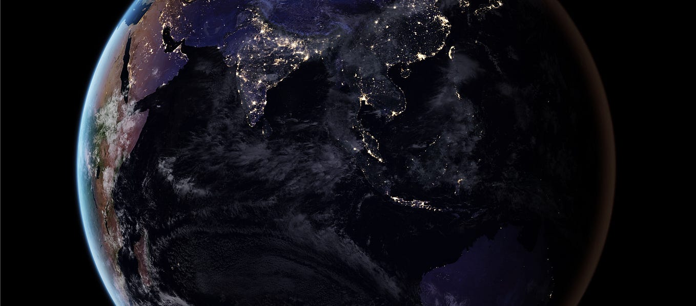 Image of the Earth at night, taken from Space, showing the outlines of Asia.
