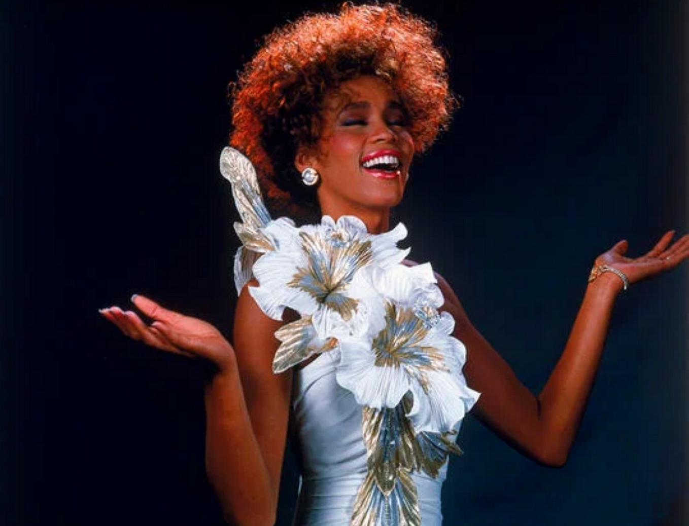 Sarah Jessica Parker wore this dress in the opening scene of the 2008 Sex and The City movie, but it was originally designed for Whitney, who wore it in a 1987 promotional photoshoot.