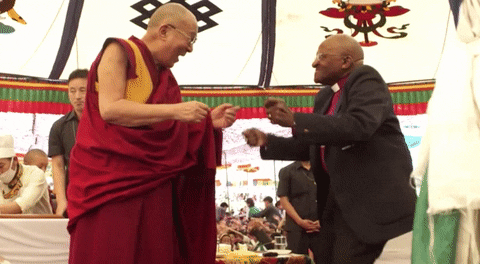 The Dalai Lama and Archbishop Desmond Tutu dancing.