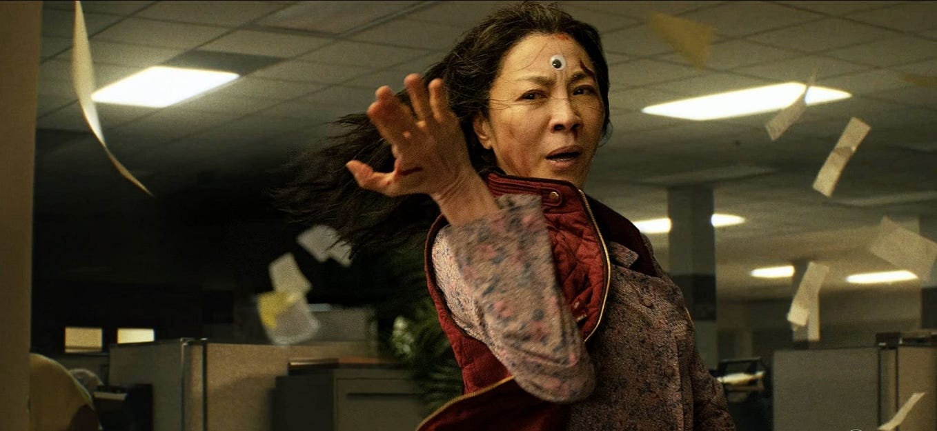Still of Michelle Yeoh as Evelyn Wang in 2022’s Everything Everywhere All At Once, creating a tailspin in the IRS office