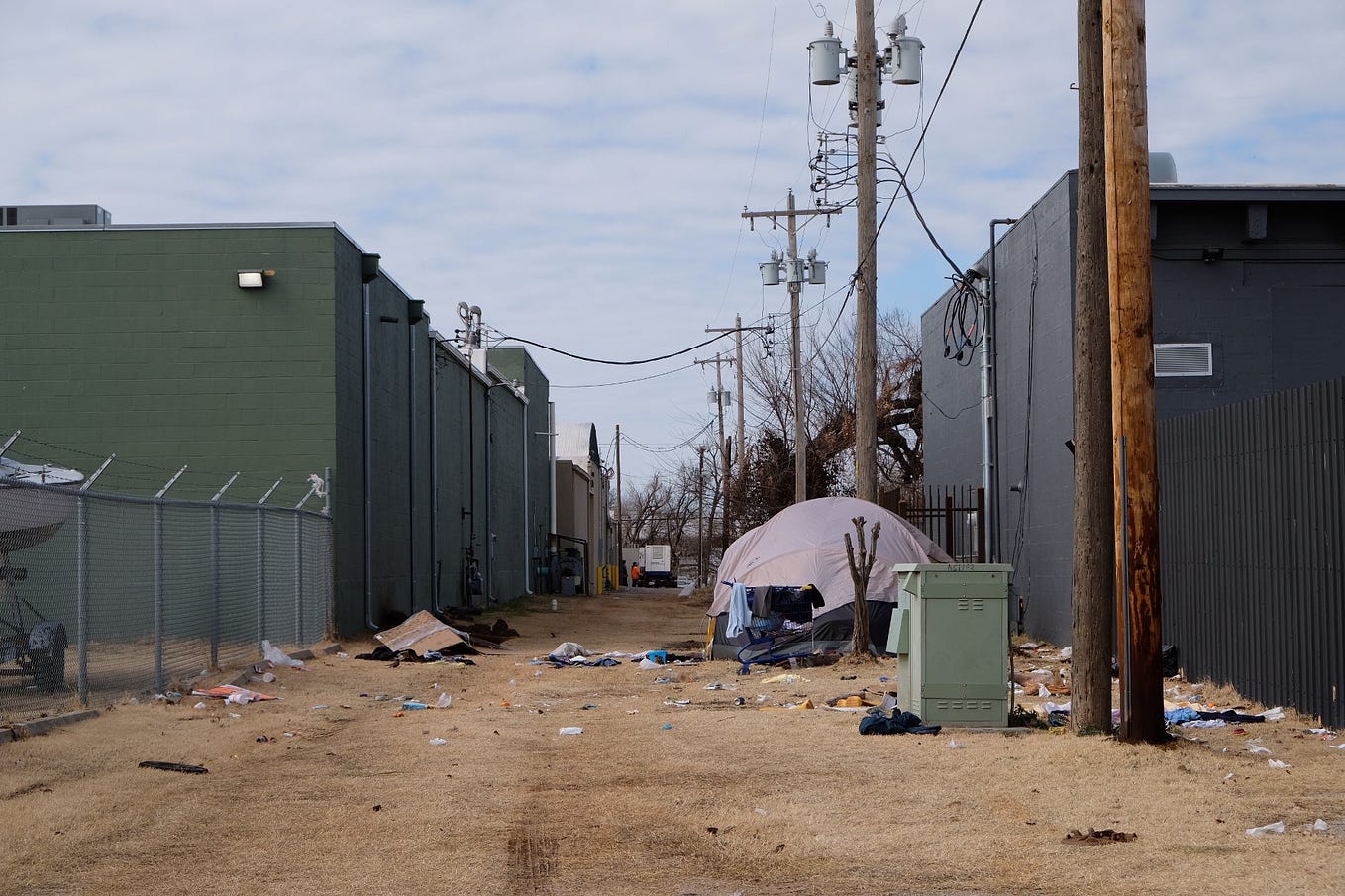 A tent and scattered belongings in an alley near the Homeless Alliance in Oklahoma City.