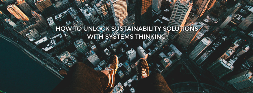 Aerial view of city scape with text, how to unlock sustainability solutions with systems thinking