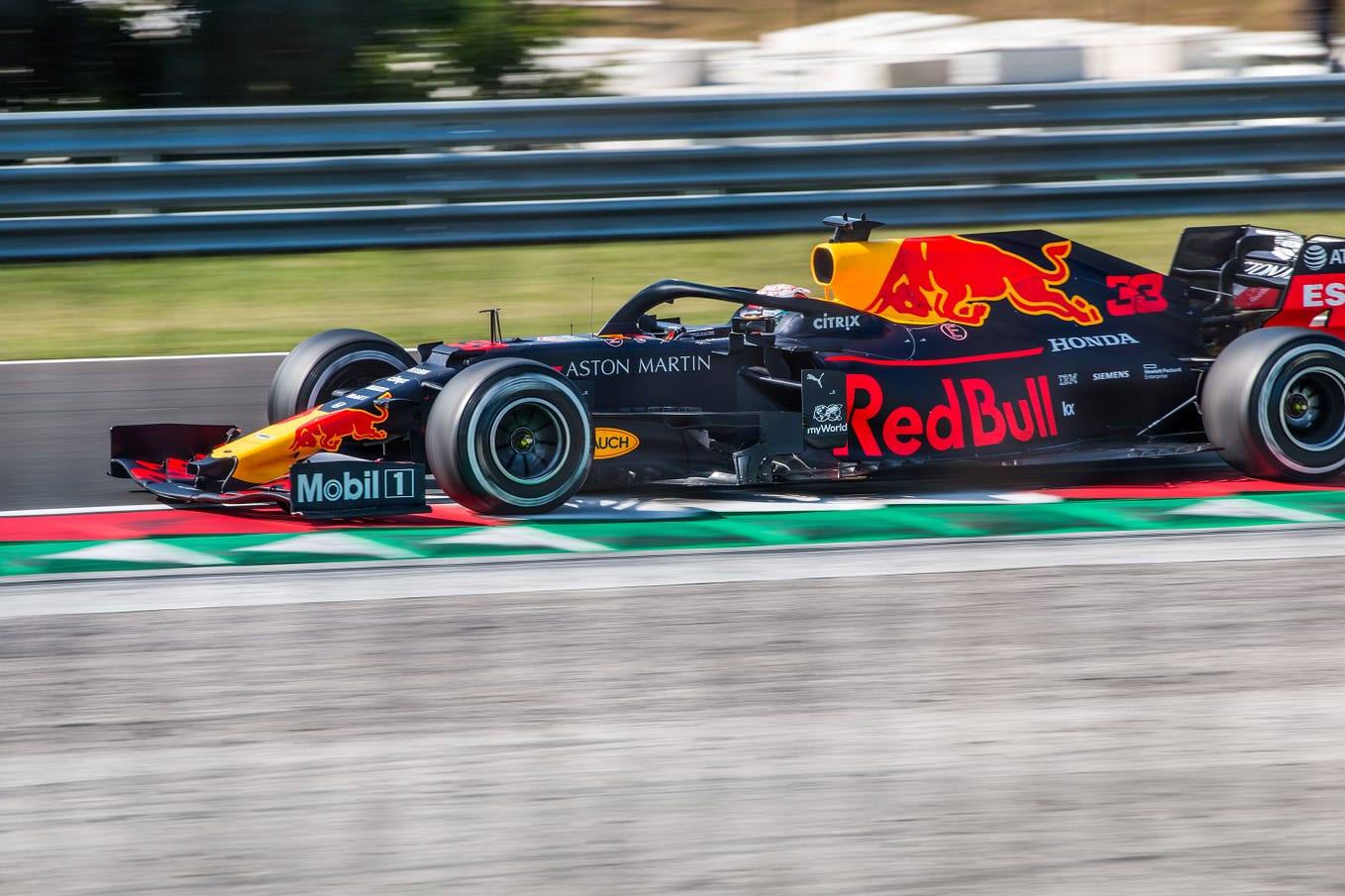 Max Verstappen racing in his black, red and yellow Red Bull RB15 during the Formula 1 Hungarian Grand Prix 2019 at the Hungaroring