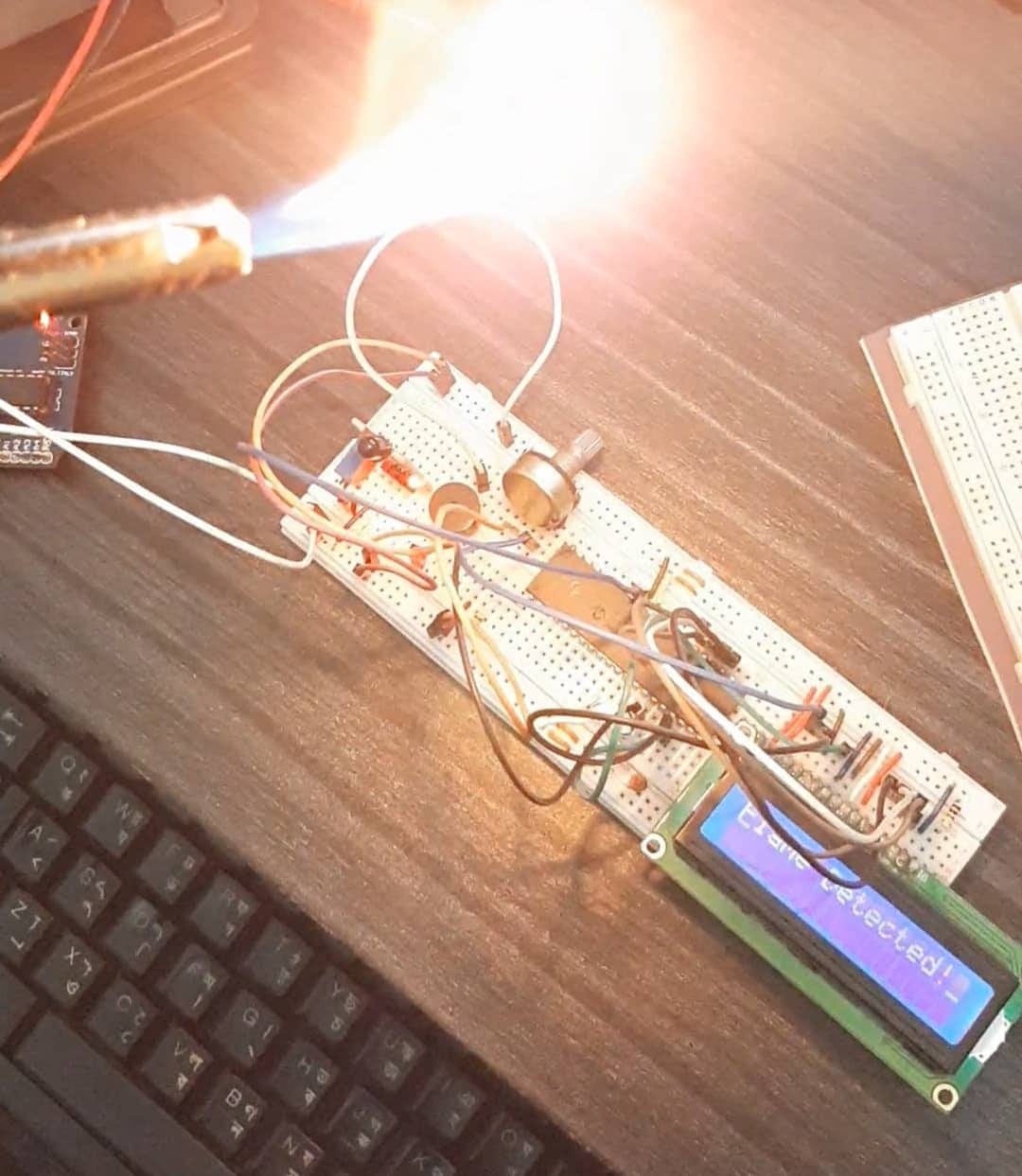 Build a fire alarm system using PIC16F877A by tahmid pranto Build