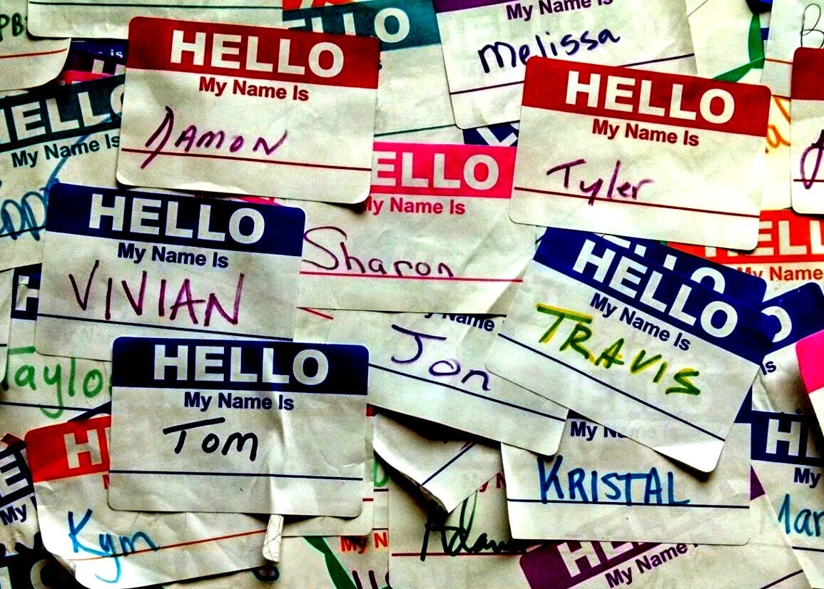 A collage of “Hello My Name Is” stickers with names such as: Damon, Sharon, Tom, Jon, Vivian, Travis, and Kristal.