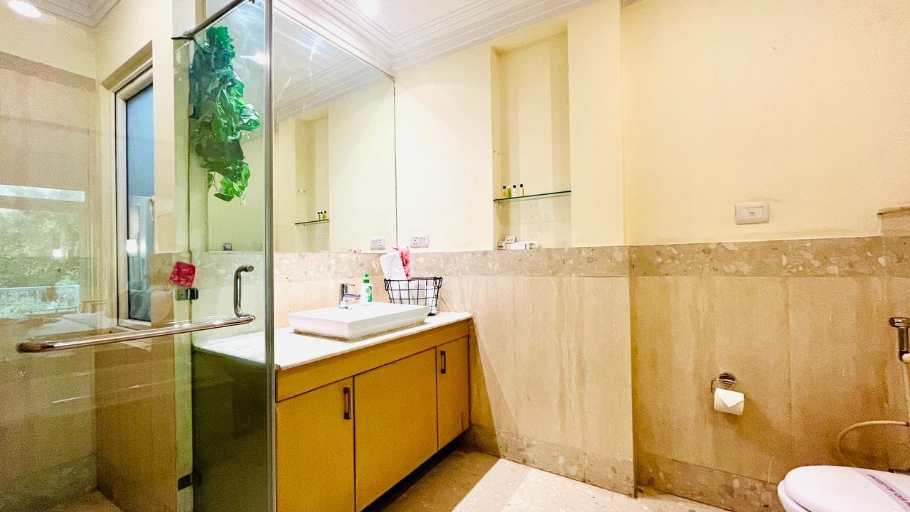 What are the amenities included in the serviced apartments