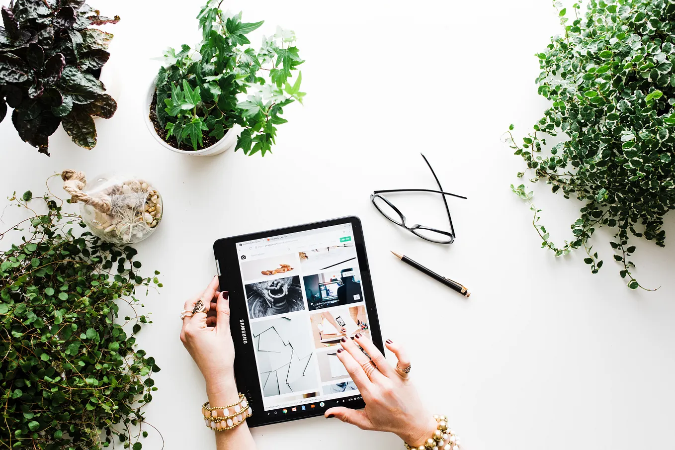 tablet on a desk with plants
