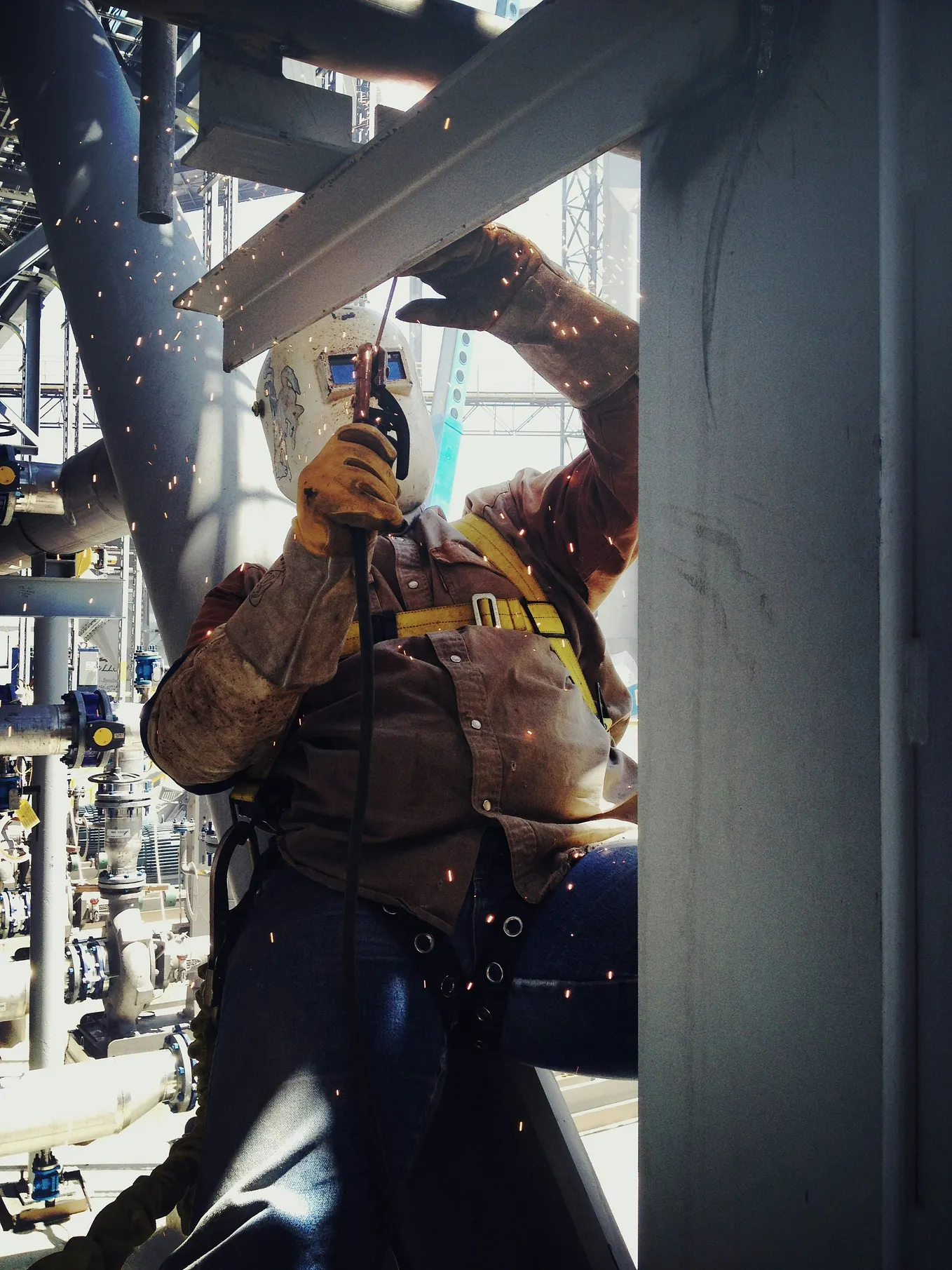 Pipe welder welding structural pipe. Building the infrastructure and building of America. Welding is a skilled trade. Welding is a skilled trade that has no room for error. Hard working man. Working class, blue collared working man.
