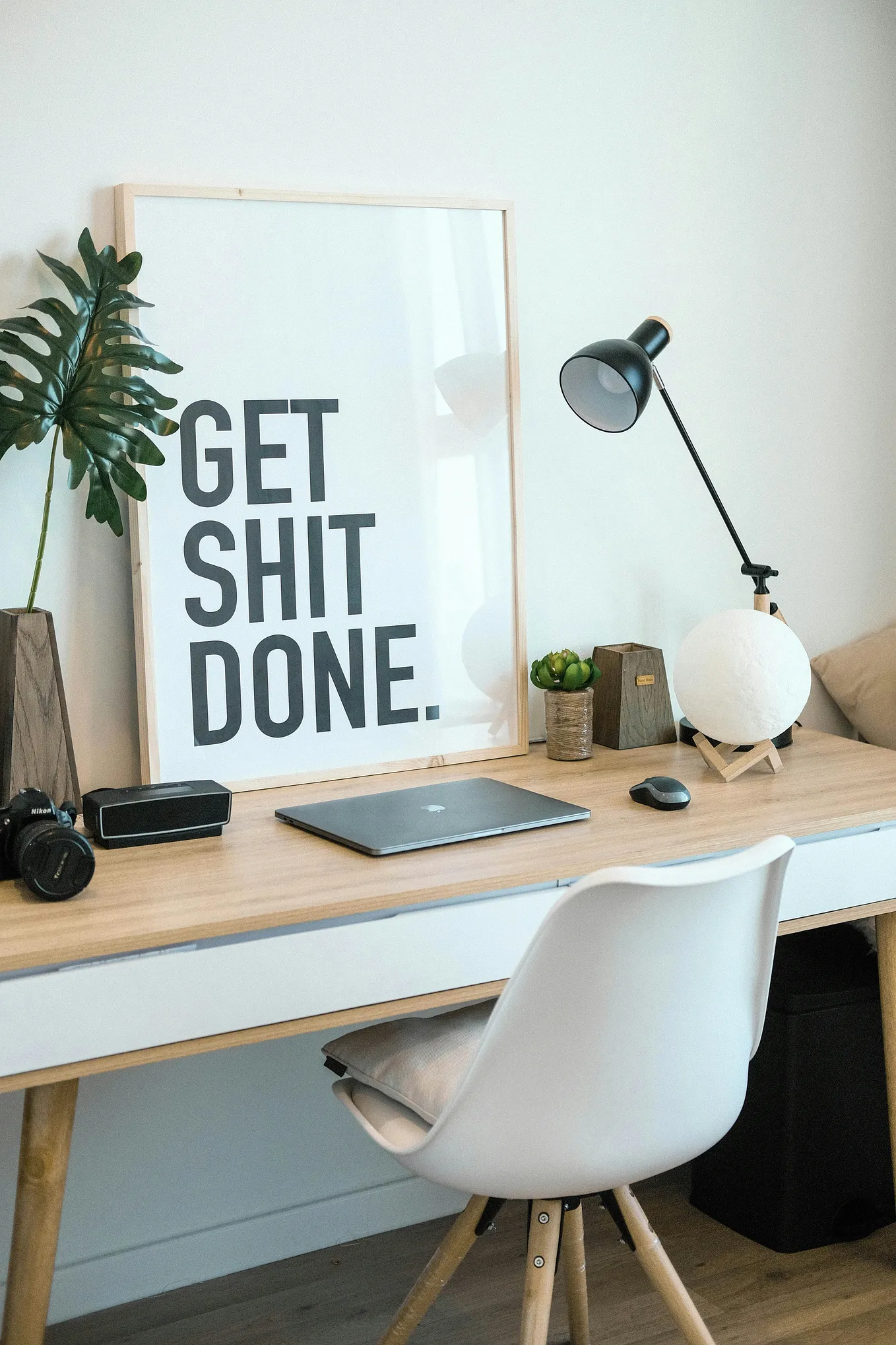 laptop on a table with frame