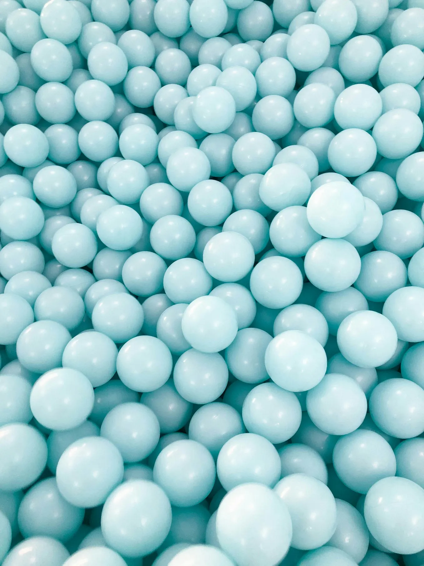 The whole image is made out of turquoise blue ballons looking like balls.
