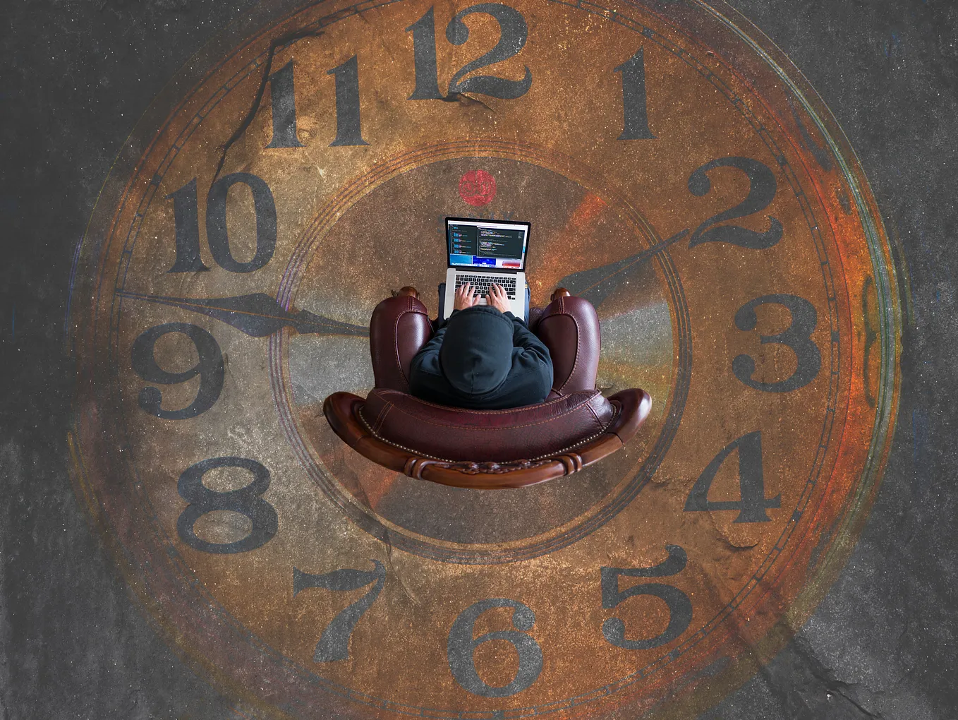 A top view of a developr working on a laptop