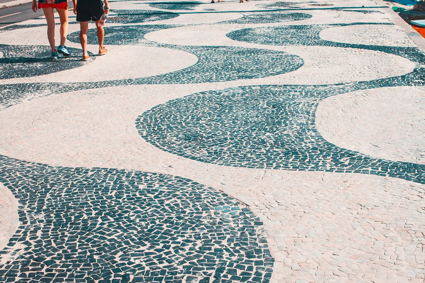 A closeup of the iconic undulating tile boardwalk of Rio’s Copacabana Beach