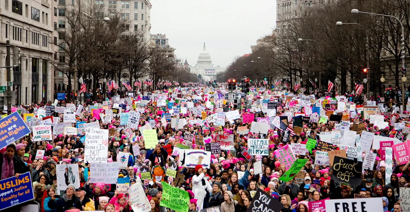 Large “pussy hat” demonstration along Pennsylvania Ave, the Capitol in the background