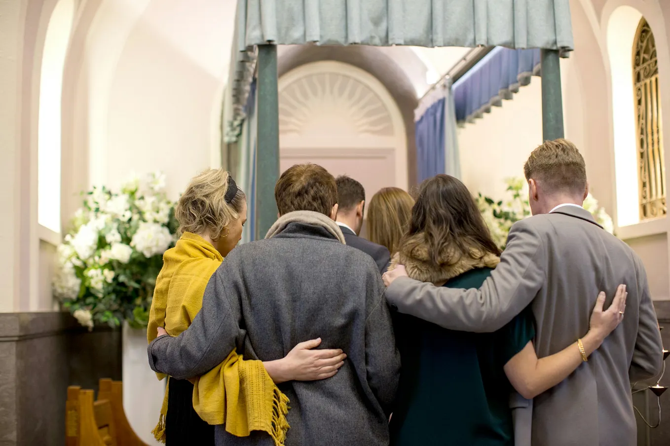 Stock photo of mourners at a funeral