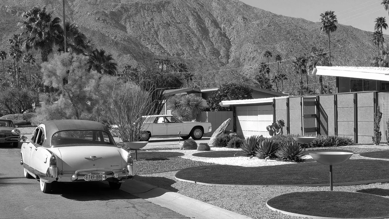 Photo of midcentury modern house and cars