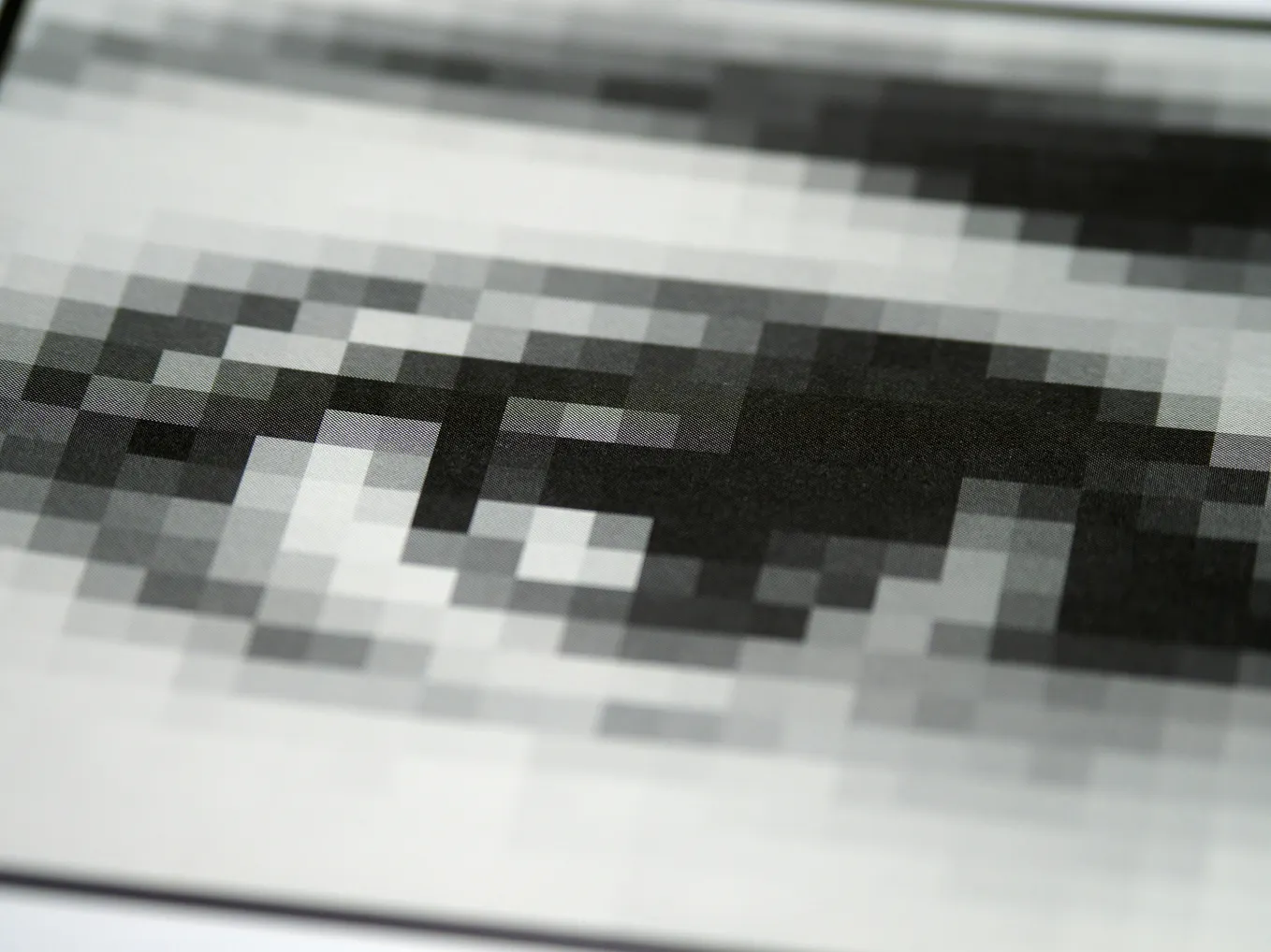 A black-and-white pixellated eye