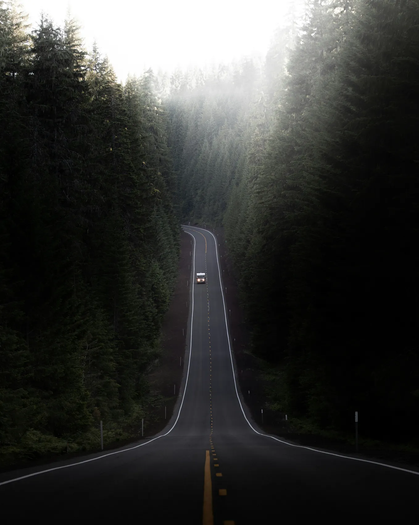 An empty highway stretching into the distance at dawn, representing a software engineer’s two-hour daily commute after their company announced a mandatory return to office policy.