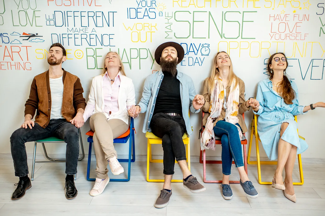 Group of diverse people on the white wall background