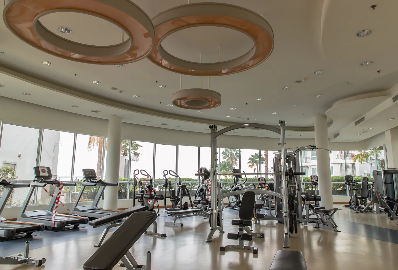 Workout room/gym with a variety of strength and cardio equipment, no people are present