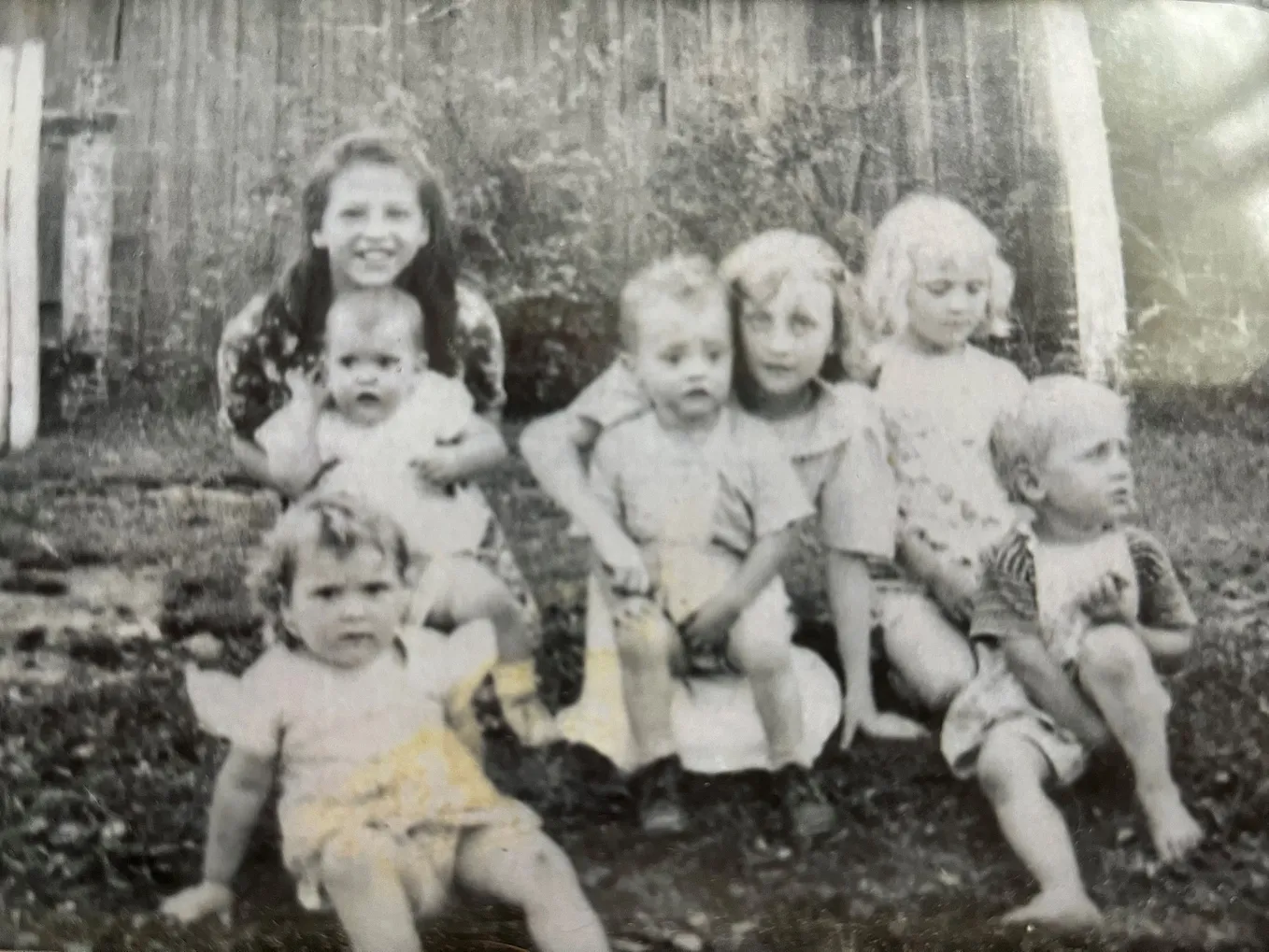 Old black and white photo from the 1940s showing Appalachian children posing together.