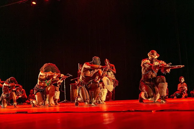 Public domain: (cc-zero, image retrieved via Wikimedia Commons), ‘Step Afrika!’ photo by U.S. Embassy Ghana, Description: Step Afrika, a high-energy, award-winning African-American dance company dedicated to the tradition of “stepping” as both dance and cultural expression.