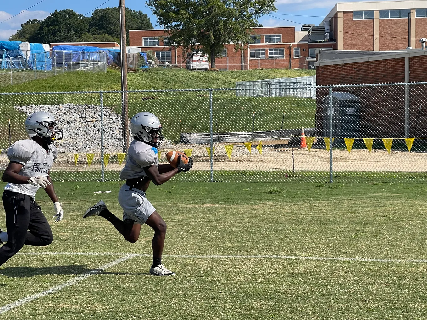 VIDEO: Getting back to tradition, brick by brick: George Washington football readying for season