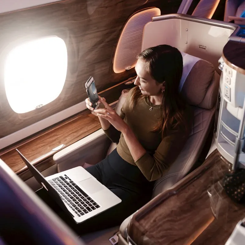 a woman in a business class flight