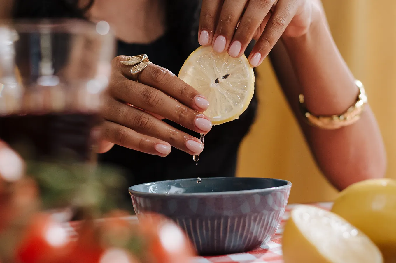 A woman squeezing a lemon
