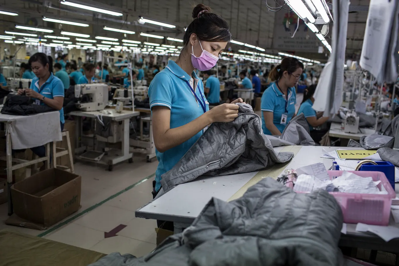 Garment worker making winter jackets for an international brand, Dong Nai province, Vietnam. Photo: Sam Tarling/Oxfam