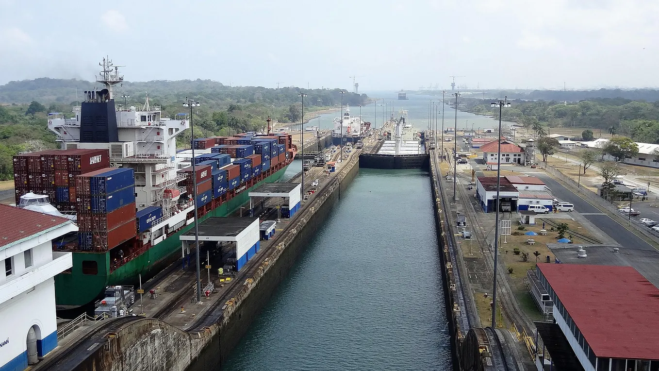 Panama Canal with a Panama cruise ship and cargo ship crossing paths