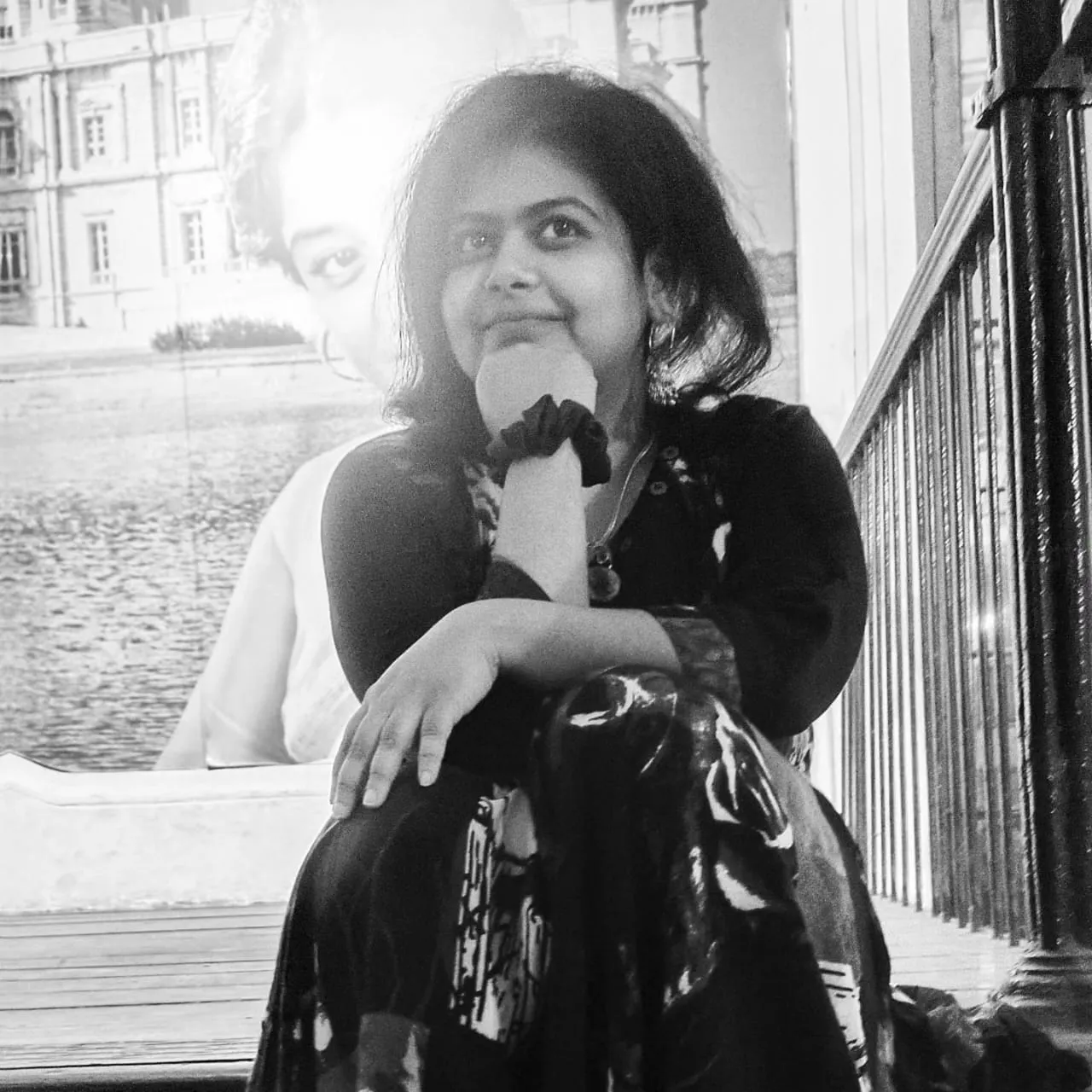 A girl (the author) sitting in the stairs