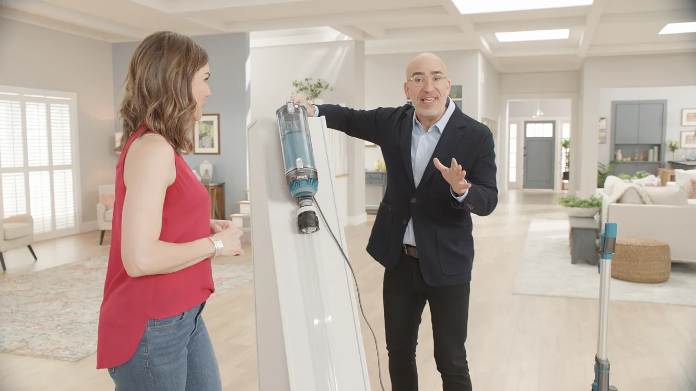 Mark Rosenzweig demonstrates his Shark brand vacuum.